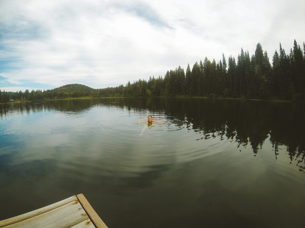 Kelly swimming in a lake