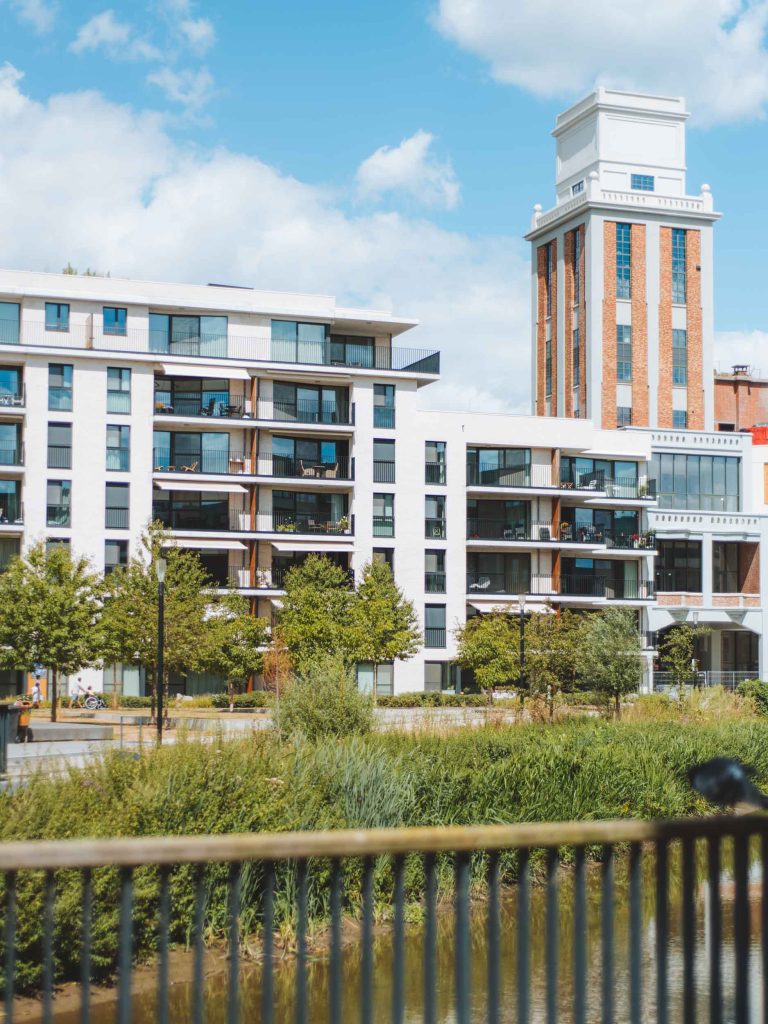 modern white apartment buildings next to the water