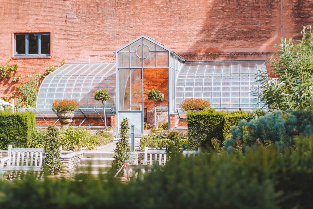 an orange greenhouse in the kruidtuin in leuven