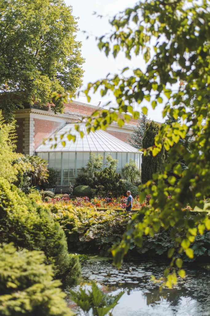 man walking outside in the kruidtuin in leuven