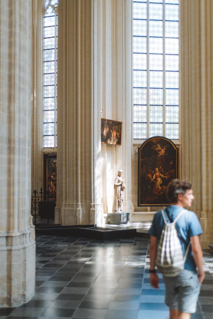 florian walking inside the st peter church with paintings in the background