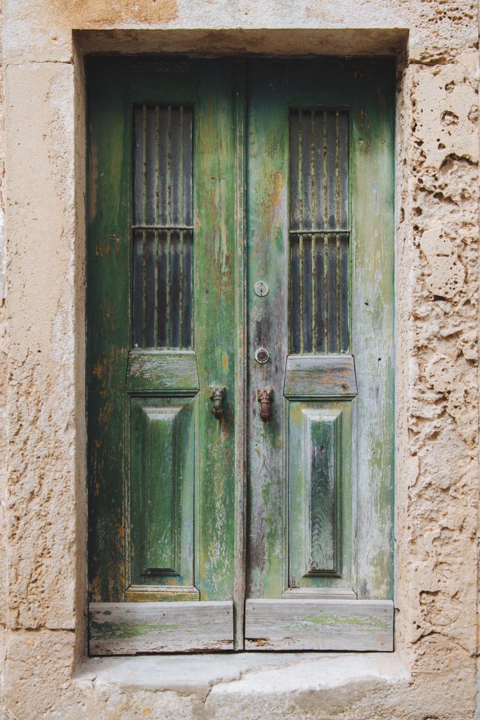 green wooden front door in the historic centre of obidos