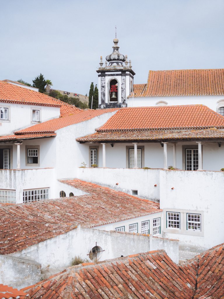 terracotta rooftops in the town of obidos in portugal