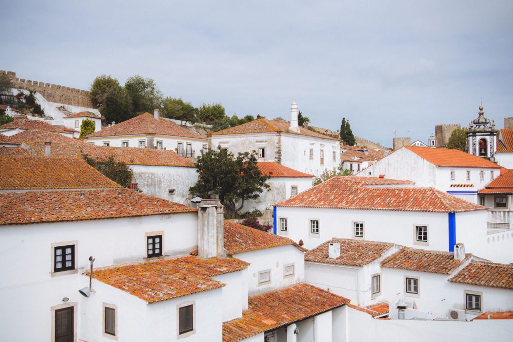 terracotta rooftops in the town of obidos in portugal