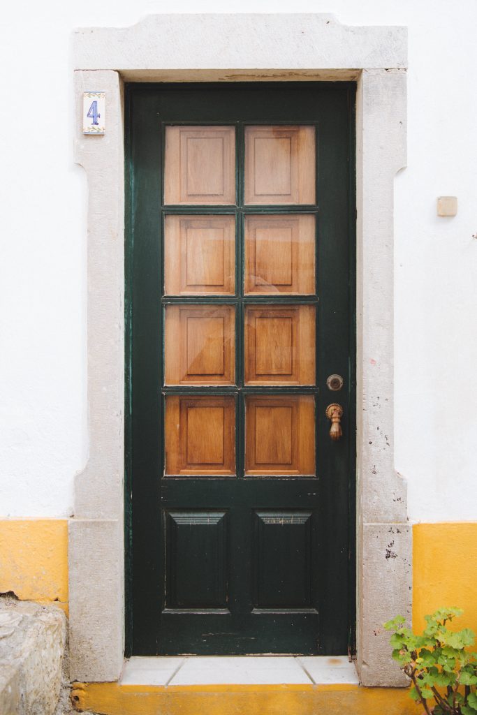 wooden front door in the historic centre of obidos