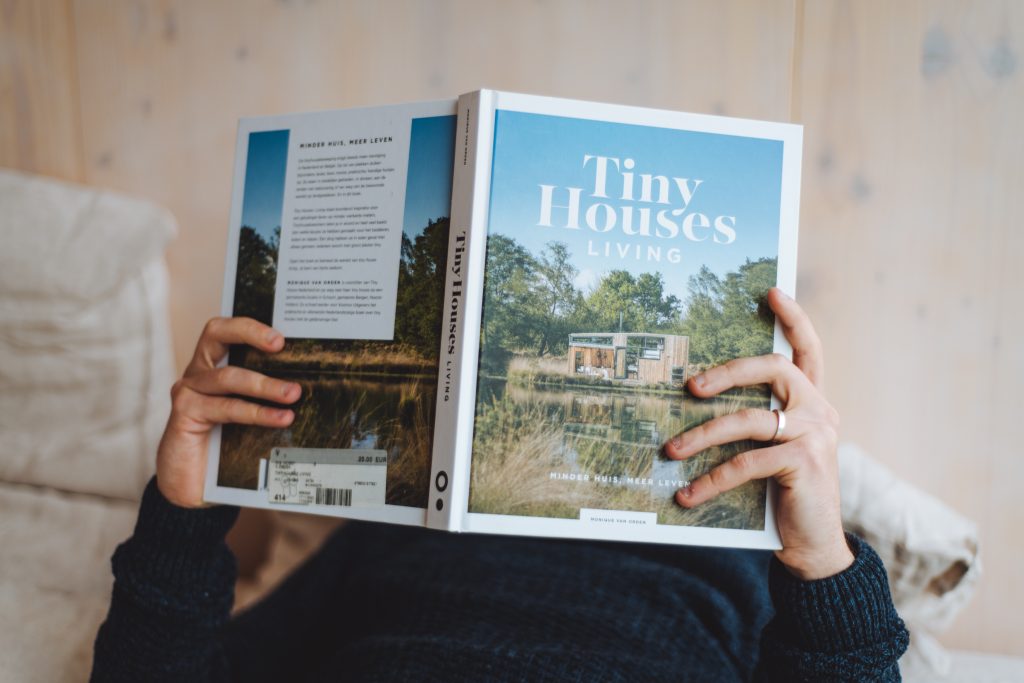 reading a book called tiny houses living