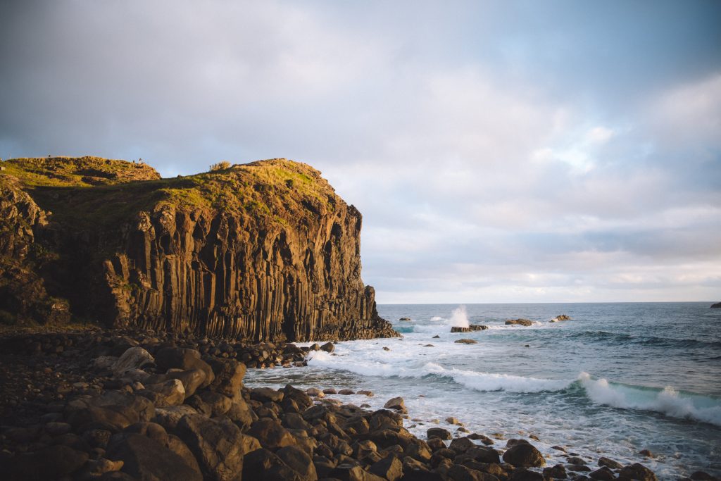 basalt cliff with rocks by the ocean in madeira